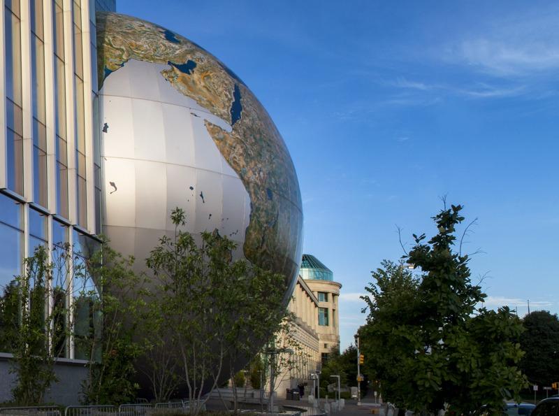 The SECU Daily Planet with the Acro Dome in the background in late day sun.